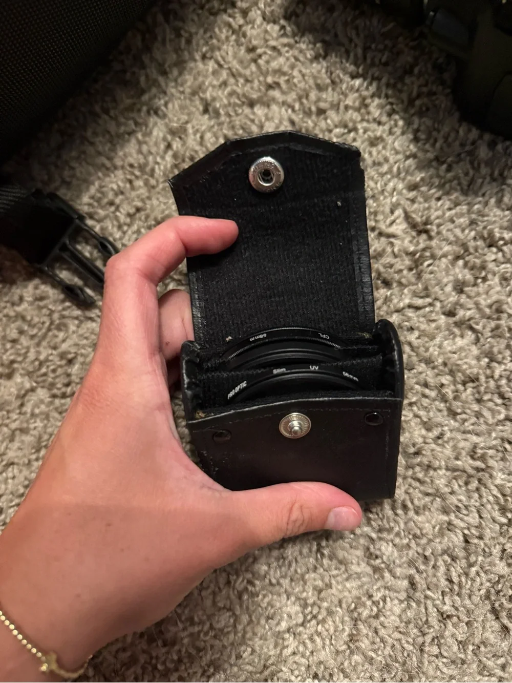 Nikon Black DSLR with Zoom Lens and Branded Neck Strap